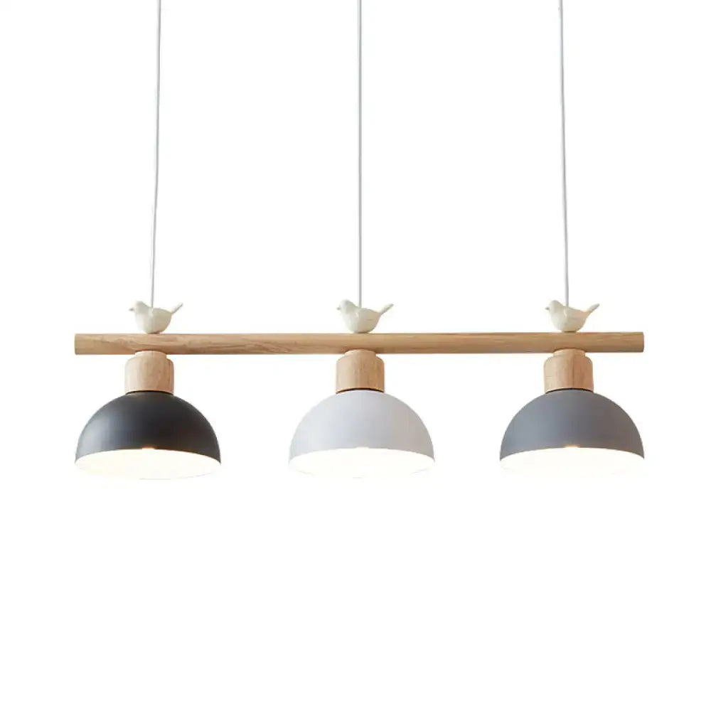 Minimalist wood and white bird hanging island light dining room