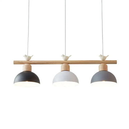 Minimalist wood and white bird hanging island light dining room