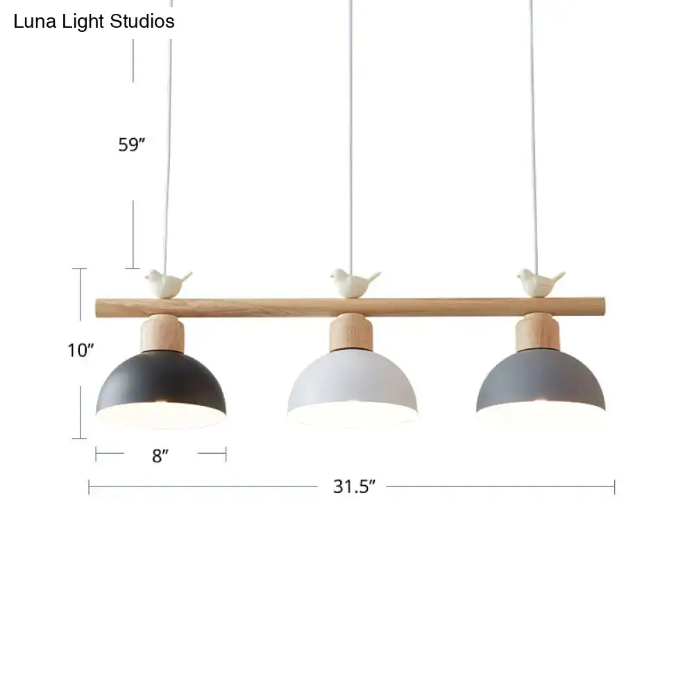 Minimalist wood and white bird hanging island light dining room