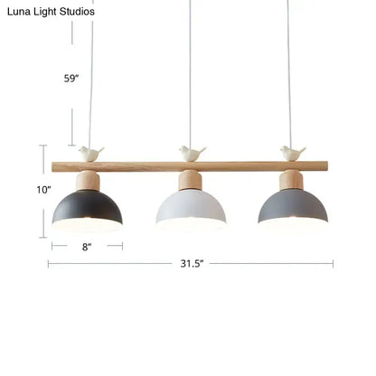 Minimalist wood and white bird hanging island light dining room