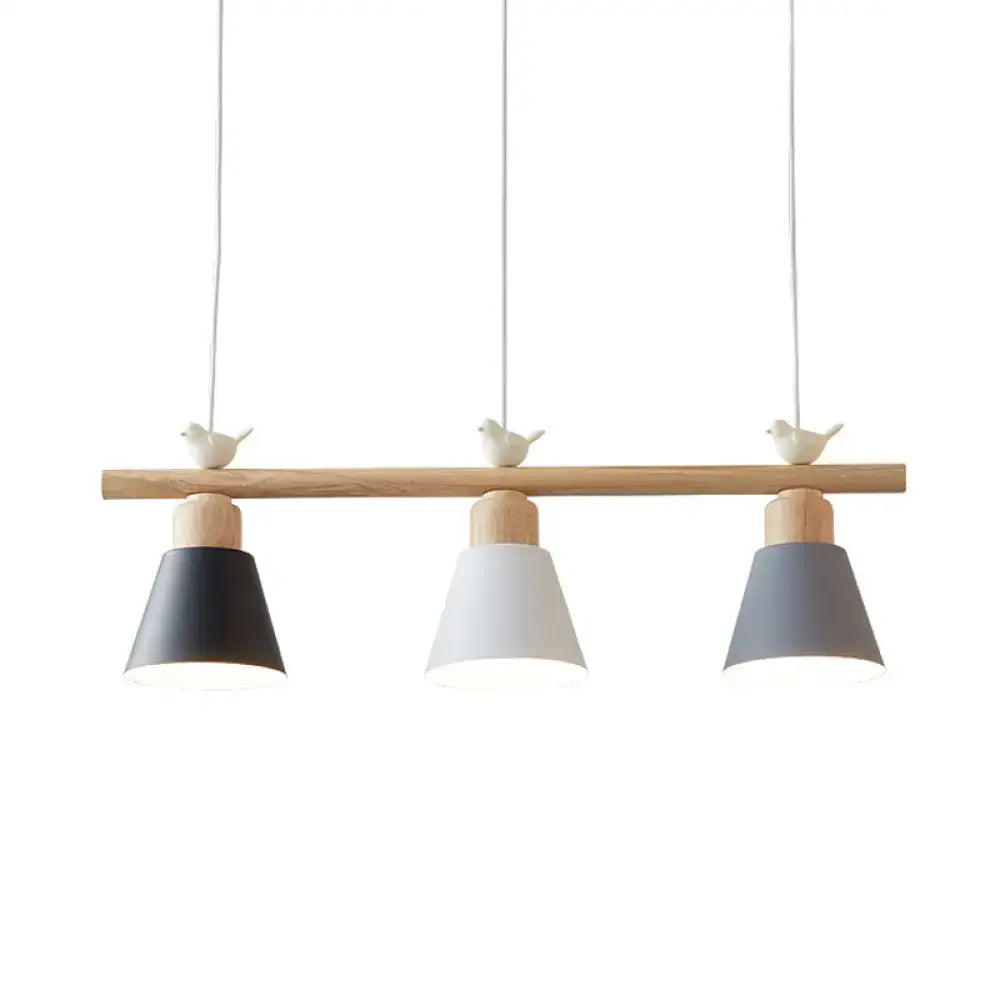 Minimalist wood and white bird hanging island light dining room