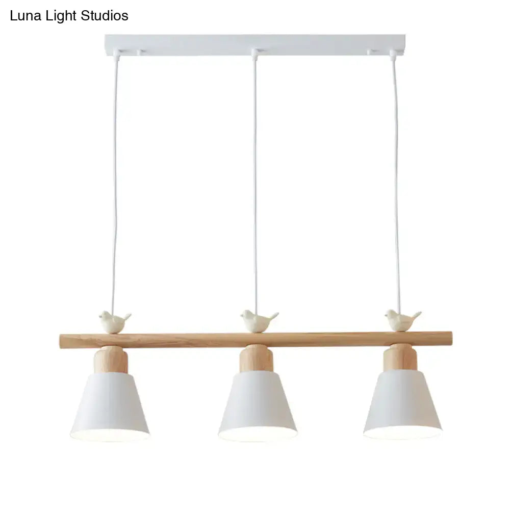 Minimalist wood and white bird hanging island light dining room