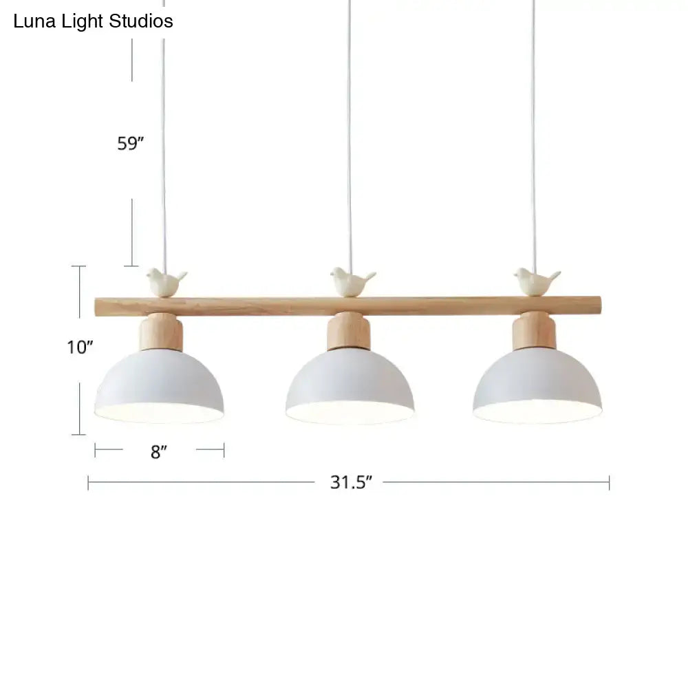 Minimalist wood and white bird hanging island light dining room