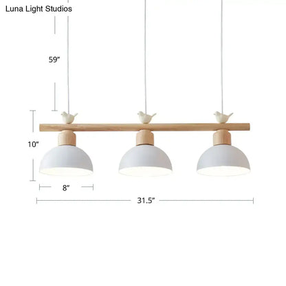 Minimalist wood and white bird hanging island light dining room