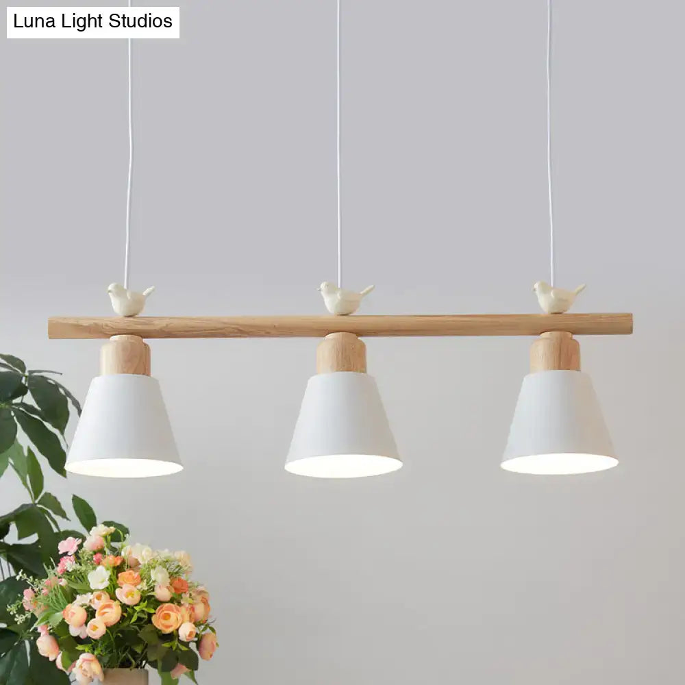 Minimalist wood and white bird hanging island light dining room