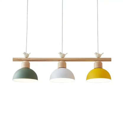 Minimalist wood and white bird hanging island light dining room