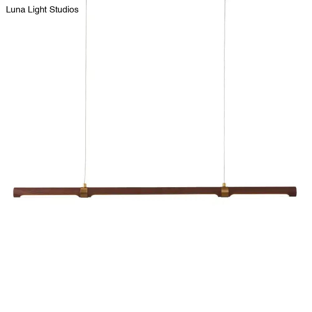 Modern wood island pendant light with brass accents dining room