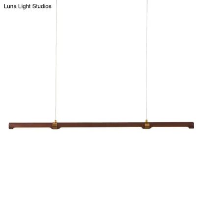 Modern wood island pendant light with brass accents dining room