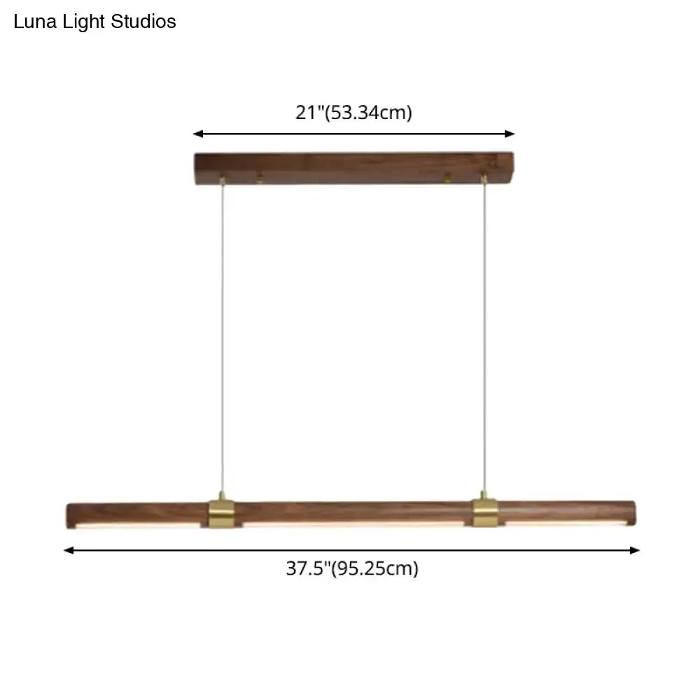 Modern wood island pendant light with brass accents dining room