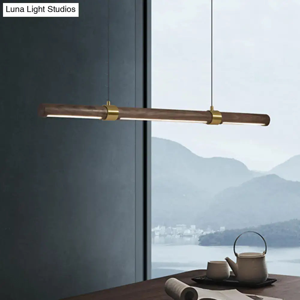 Modern wood island pendant light with brass accents dining room