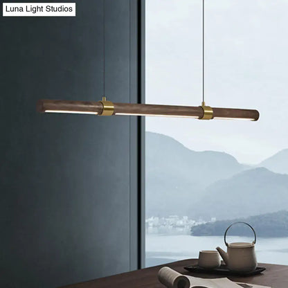 Modern wood island pendant light with brass accents dining room
