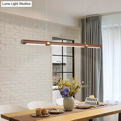 Modern wood island pendant light with brass accents dining room