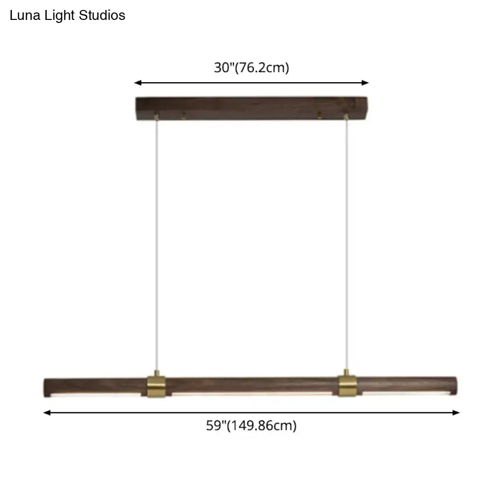 Modern wood island pendant light with brass accents dining room