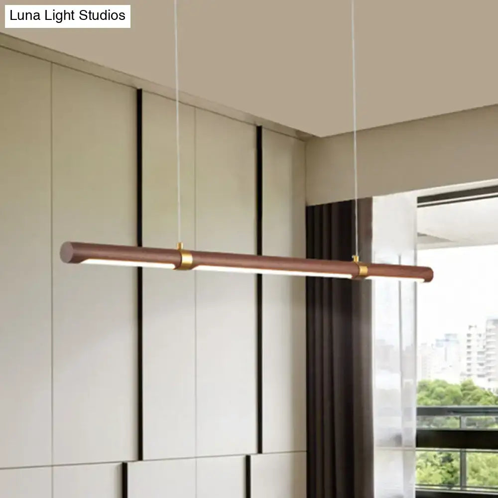 Modern wood island pendant light with brass accents dining room