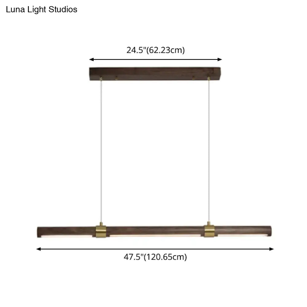 Modern wood island pendant light with brass accents dining room