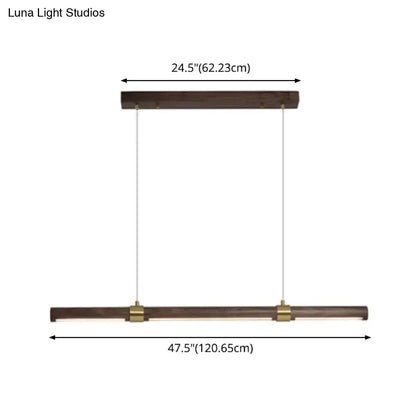 Modern wood island pendant light with brass accents dining room