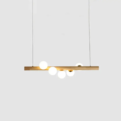 Minimalist beige wood island pendant with globe lights dining room