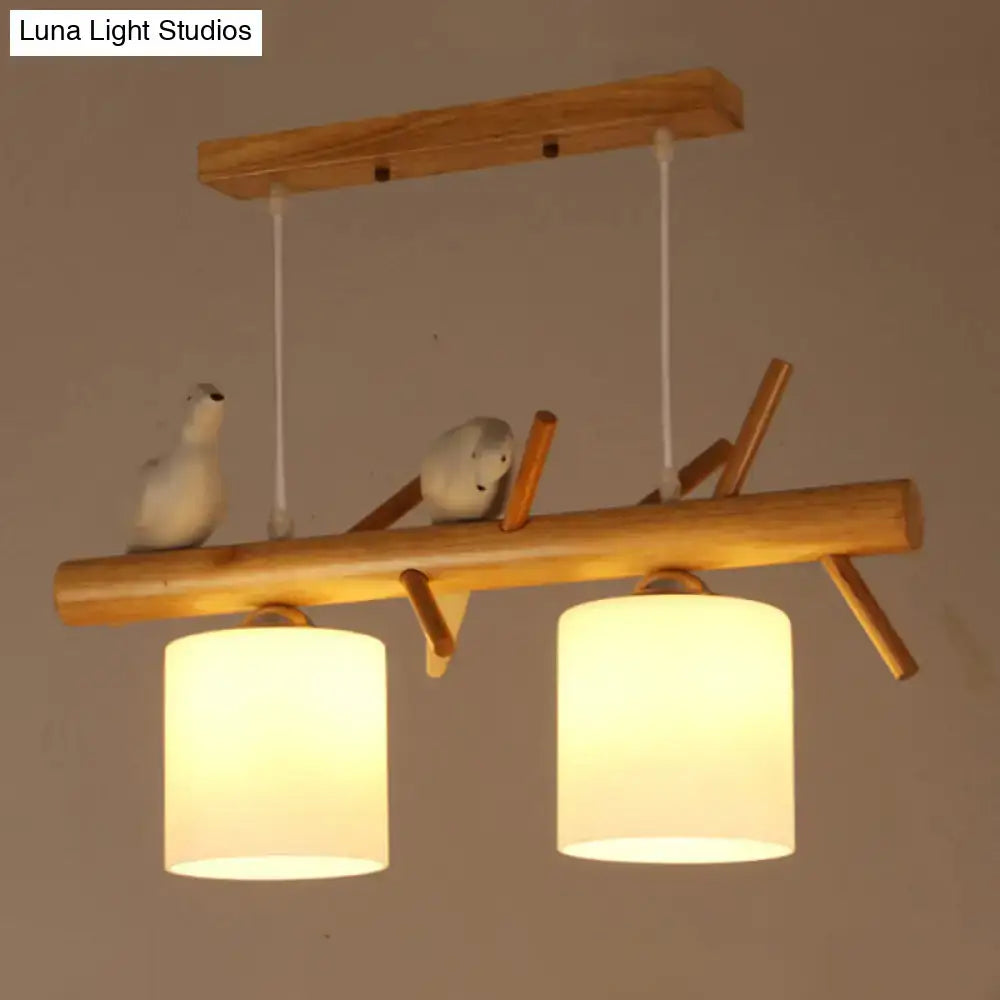 Nordic wood pendant light with resin bird decor – dining room glass