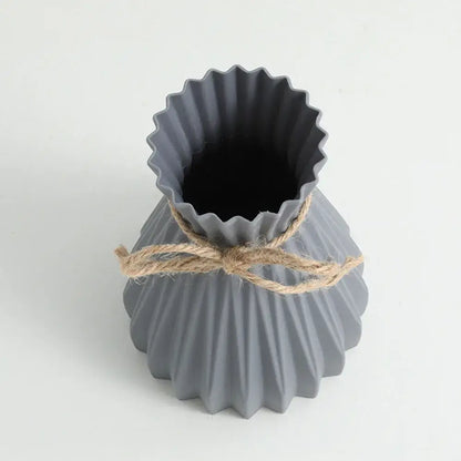 Origami style pink blue and white plastic flower vase living room