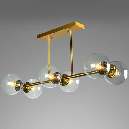 Postmodern gold kitchen island light with globe glass shade