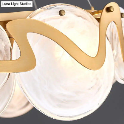 Postmodern gold and glass circle pendant light for dining room