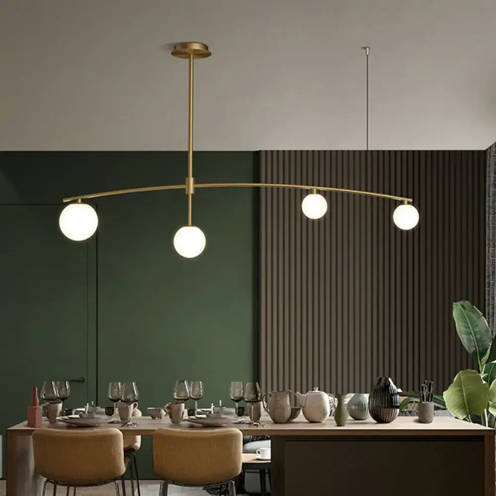 Postmodern gold pendant light with frosted white glass dining room