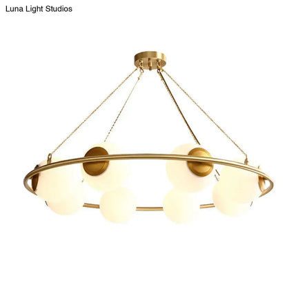 Postmodern brass circular chandelier with frosted glass dining room