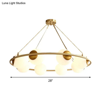 Postmodern brass circular chandelier with frosted glass dining room