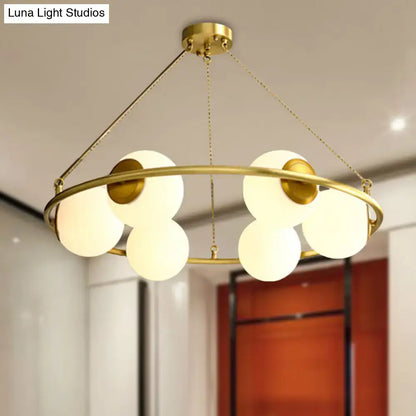 Postmodern brass circular chandelier with frosted glass dining room