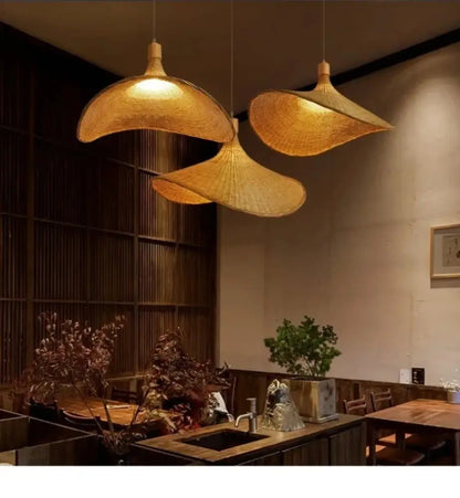 Woven golden brown rattan pendant light with dimmable bamboo shade dining room