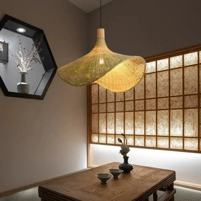 Woven golden brown rattan pendant light with dimmable bamboo shade dining room