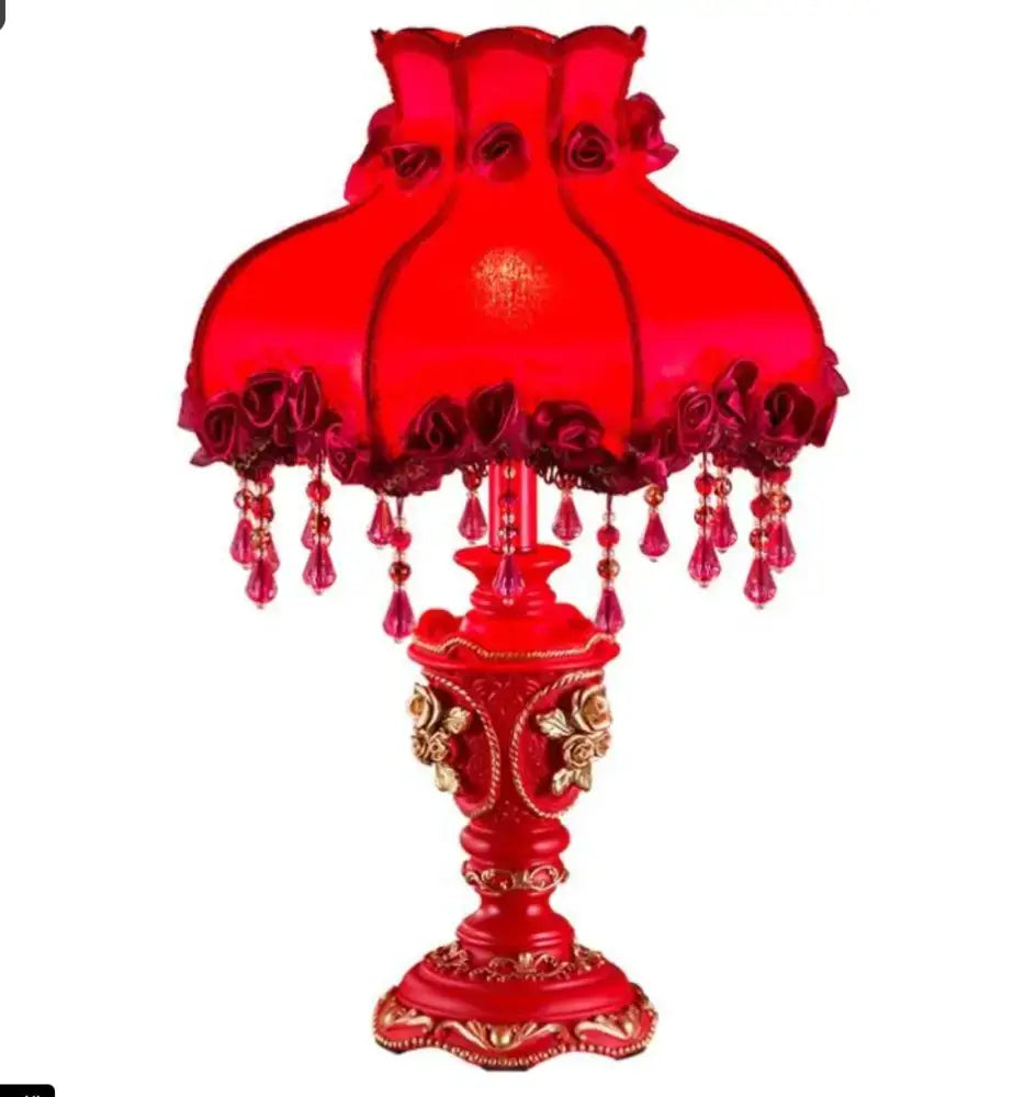 Red coloured classical table lamp with floral detail for bedroom