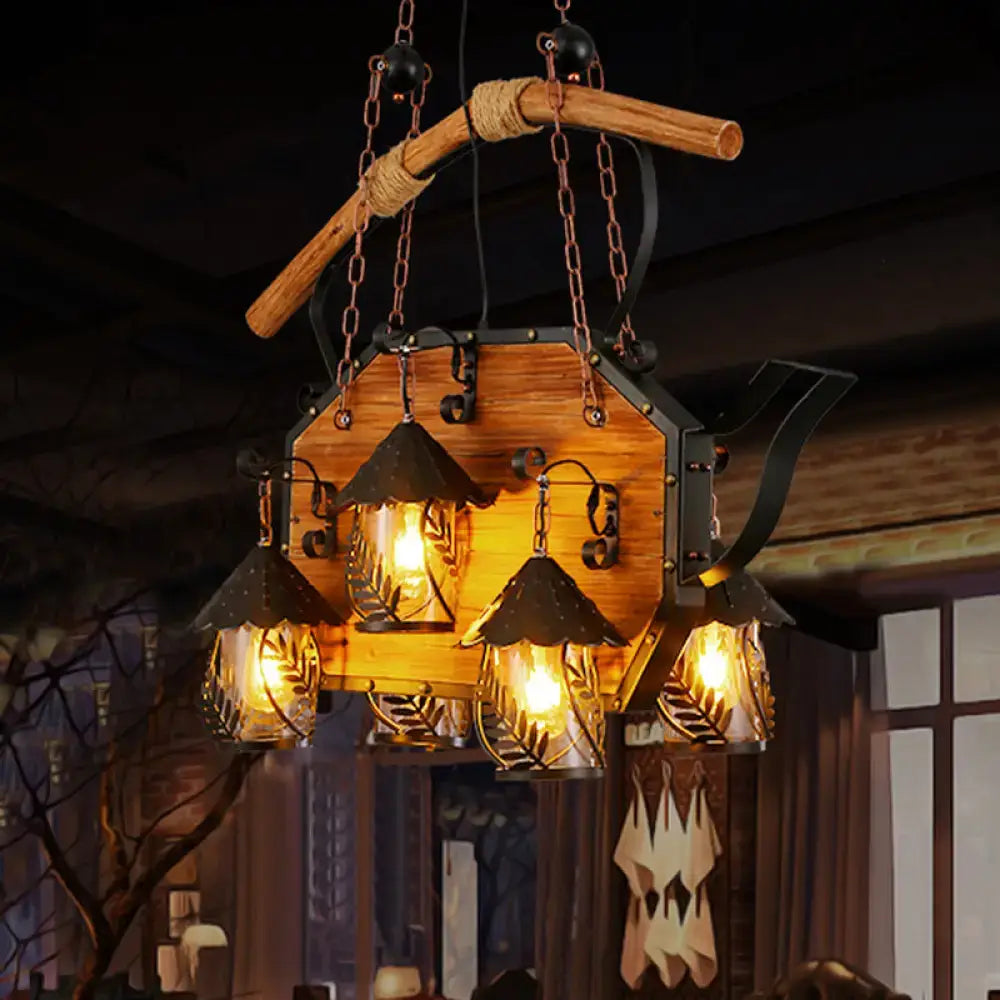 Rustic wood and black teapot light fixture clear glass dining room