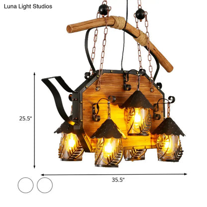 Rustic wood and black teapot light fixture clear glass dining room