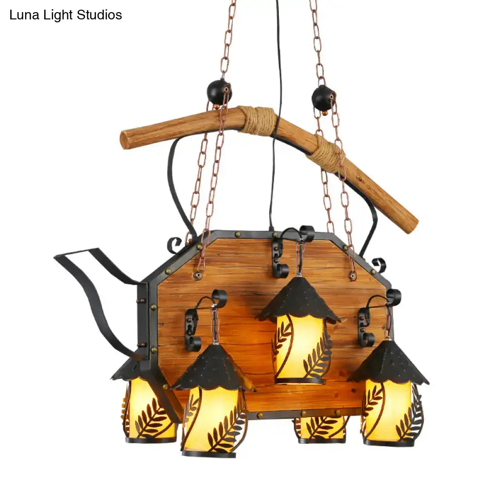 Rustic wood and black teapot light fixture clear glass dining room