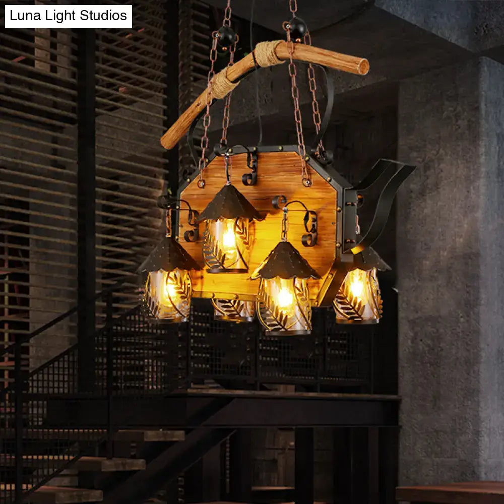 Rustic wood and black teapot light fixture clear glass dining room
