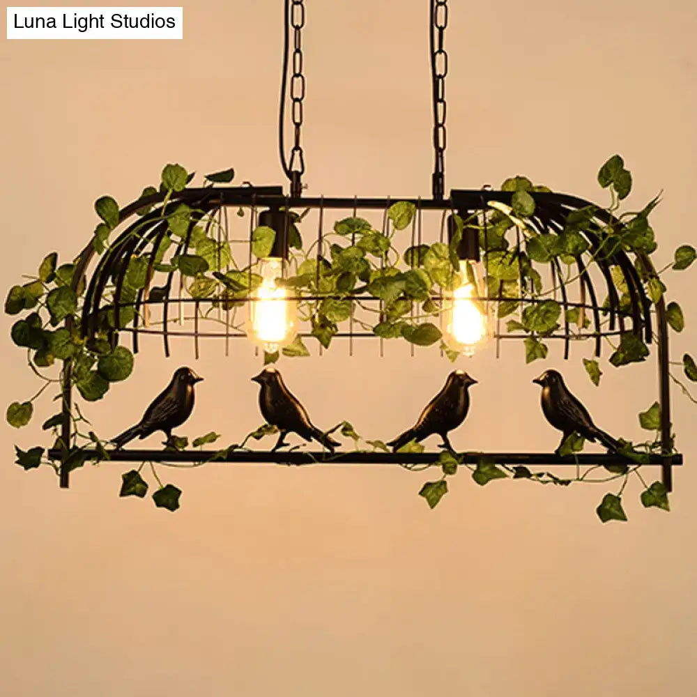 Rustic black birdcage island light with ivy for dining room