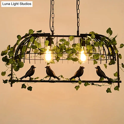 Rustic black birdcage island light with ivy for dining room