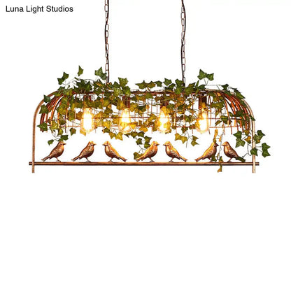 Rustic black birdcage island light with ivy for dining room