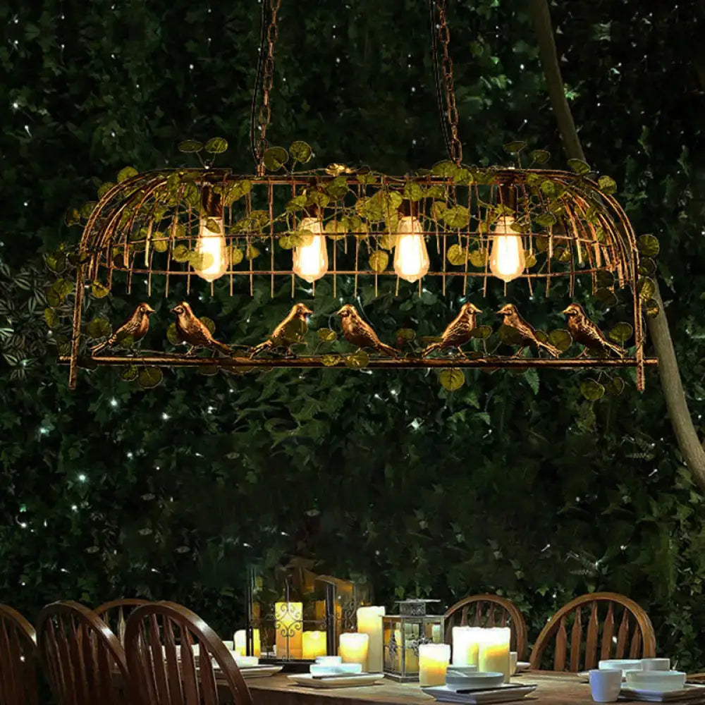 Rustic black birdcage island light with ivy for dining room
