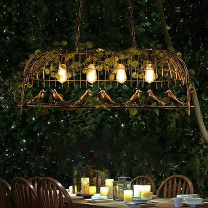 Rustic black birdcage island light with ivy for dining room