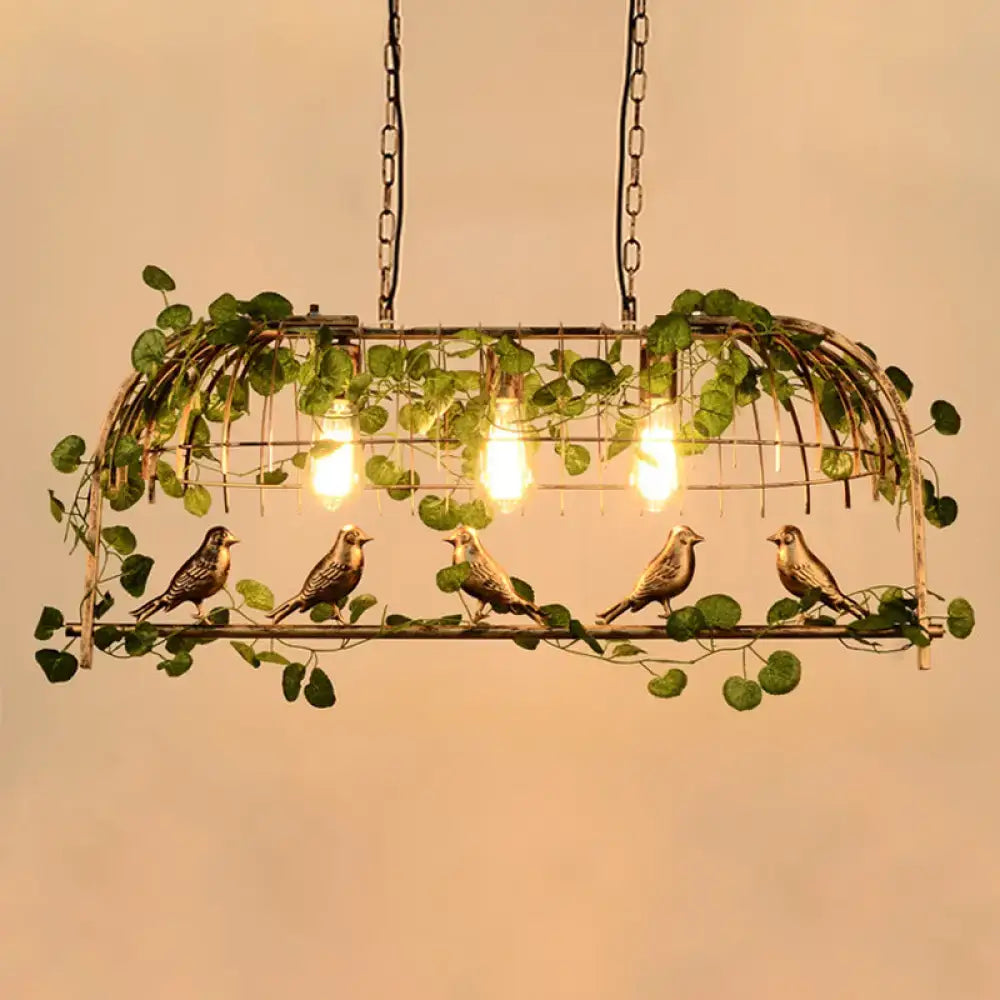 Rustic black birdcage island light with ivy for dining room