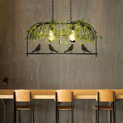 Rustic black birdcage island light with ivy for dining room