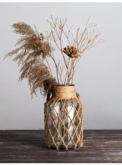 Rustic hanging glass vase with twine and metal handle – living room