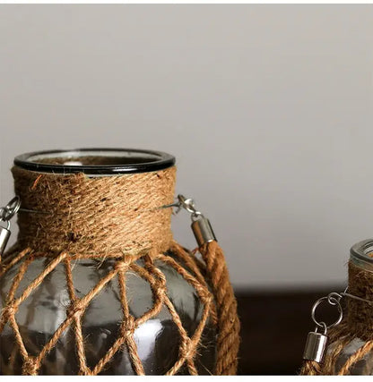 Rustic hanging glass vase with twine and metal handle – living room