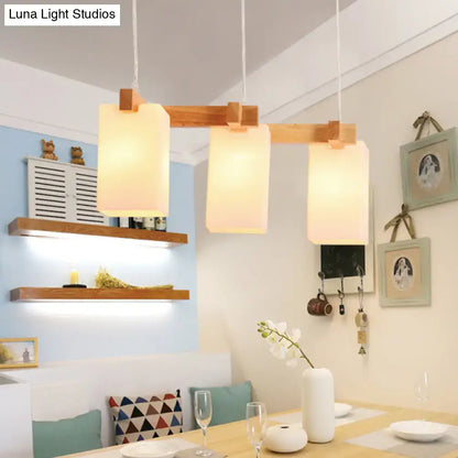 Minimalist wood island pendant light with opaline glass dining room