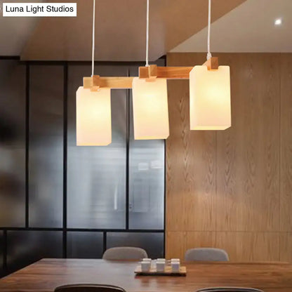 Minimalist wood island pendant light with opaline glass dining room