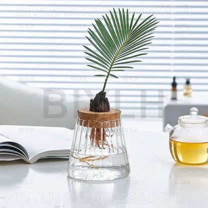 Small transparent glass vase with bamboo base for living room decor