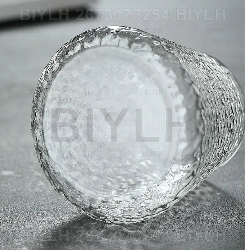 Small transparent glass vase with bamboo base for living room decor