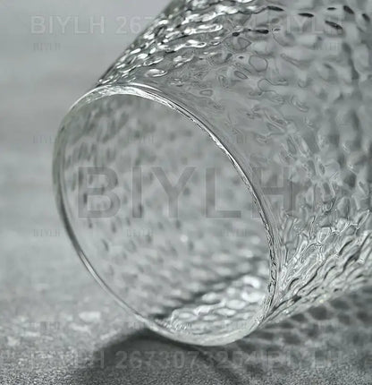 Small transparent glass vase with bamboo base for living room decor